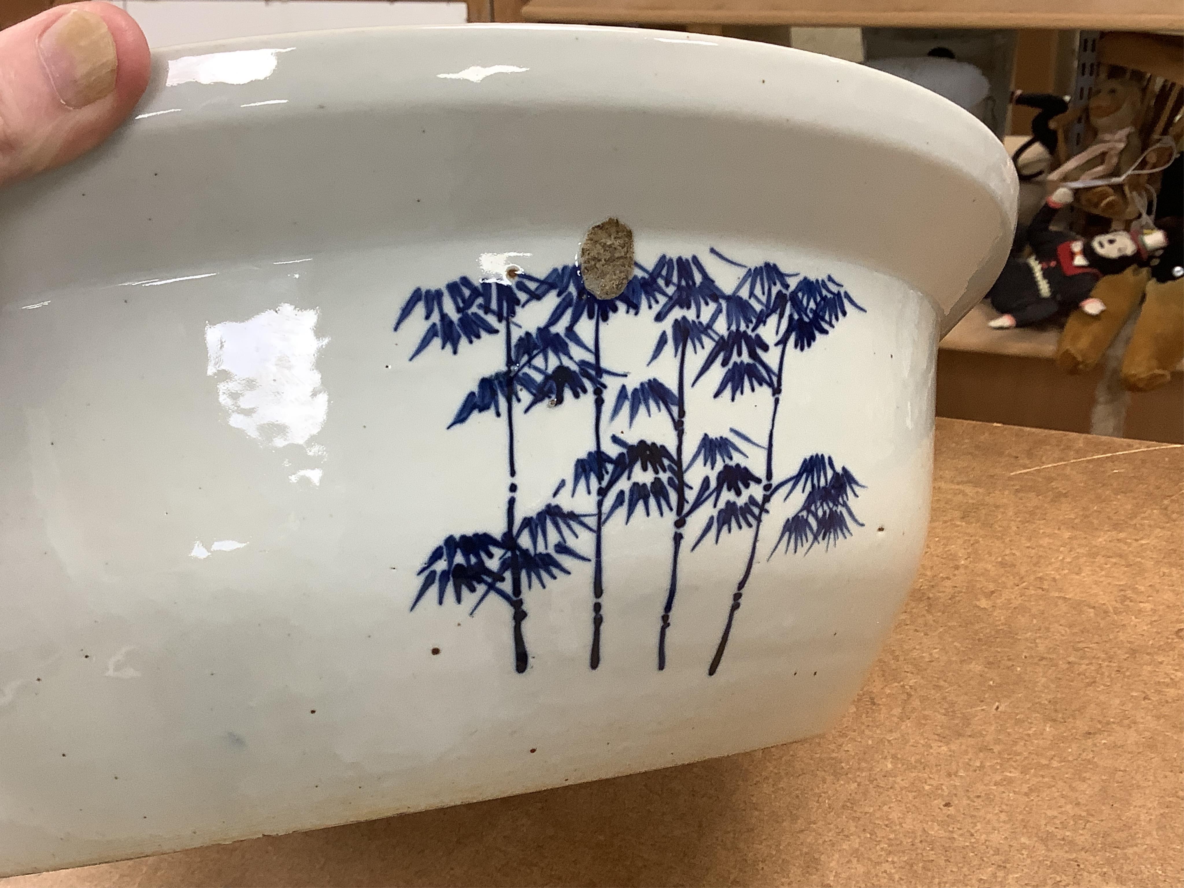 A large Chinese porcelain basin enamelled with figures, 41cm in diameter